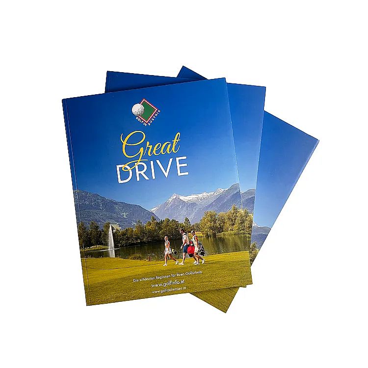 Cover of "Great Drive" magazine shows a scenic view with mountains, a lake, and two people walking on a golf course.