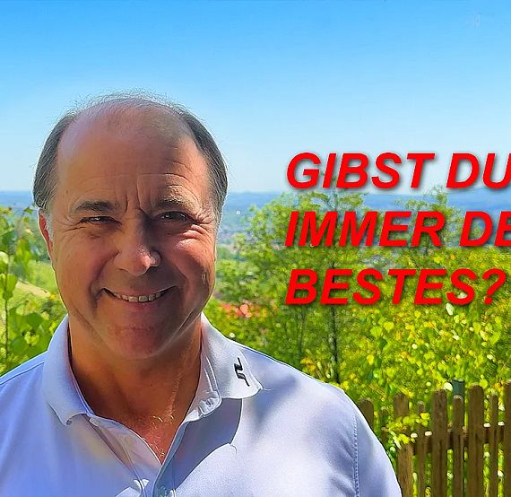 A smiling man stands outdoors with green trees and blue sky in the background. Red text asks, 'GIBST DU IMMER DEIN BESTES?' on the image.