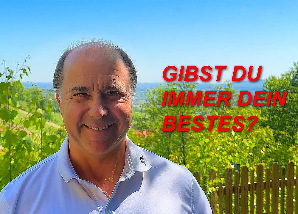 A smiling man stands outdoors with green trees and blue sky in the background. Red text asks, 'GIBST DU IMMER DEIN BESTES?' on the image.
