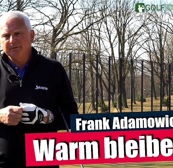 Golfer holding a club, wearing a black jacket, with trees in the background on a sunny day. Text overlay includes name and 'Warm bleiben.'