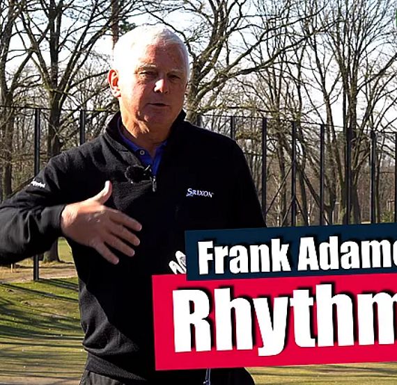 A man demonstrates a golf swing outdoors with bare trees in the background. Text overlay mentions 'Frank Adamowicz' and 'Rhythm.'