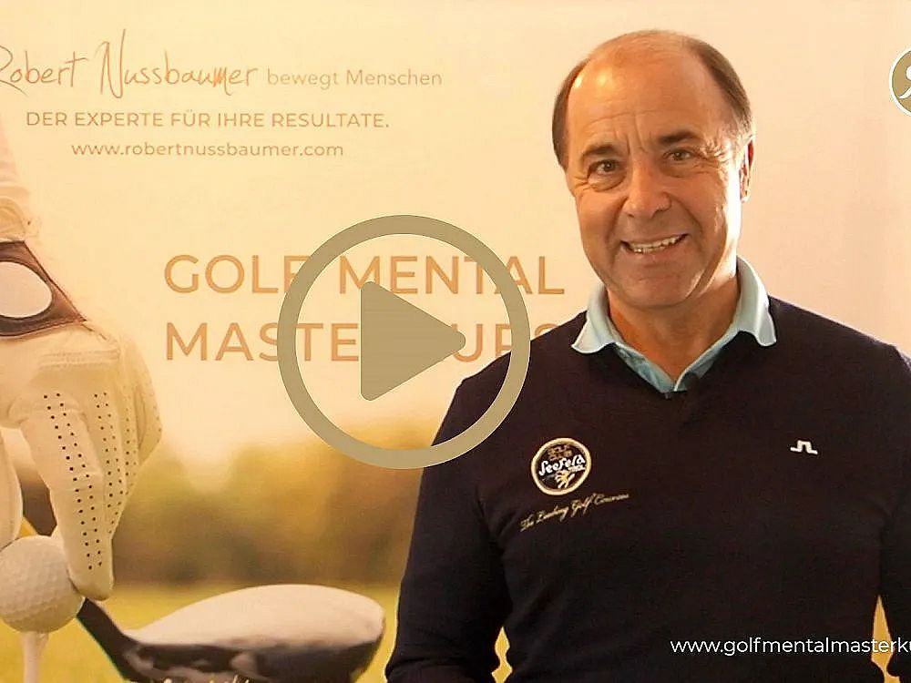 A smiling man in a black sweater stands in front of a golf-themed banner. The words "Gold Mental Mastery" are prominently displayed on the banner.
