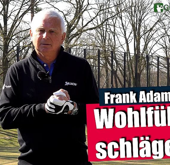Older man in golf attire holds a club on a sunny course, with trees and a Golf Time logo in the corner.
